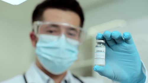 Medical Professional Holds Coronavirus COVID-19 Vaccine Vial
