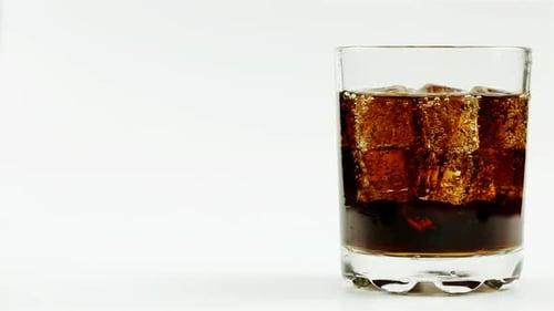 Refreshing Cola with Ice Cubes on White Background