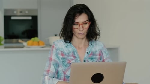 Sad Woman Reading Receiving Bad News on Laptop at Home Rbbro