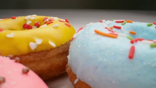 Colorful Donuts with Icing and Sprinkles