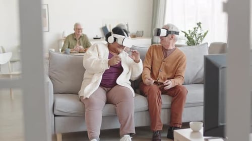Seniors Enjoying Virtual Reality Experience at Home
