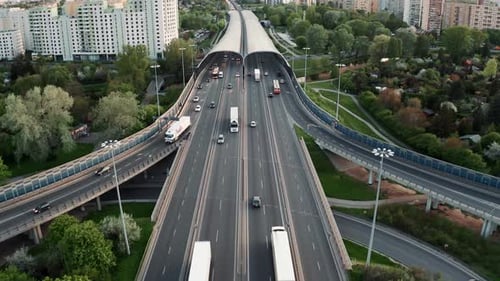 Aerial Flyover Traffic Jam Roundabout Interchange Road in Evening Drone Shot Top View Roadway