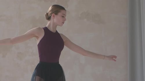 Beautiful Young Woman Dancer in Black Stage Dress Rehearses Dance Moves. Dance Lesson in Studio with
