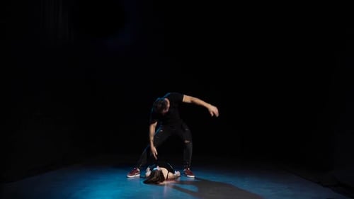 Romantic Choreography Against Black Background in Spotlight at Studio, Slow Motion.