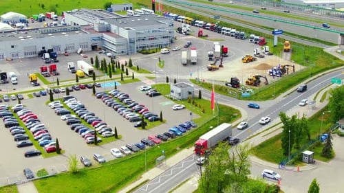 Aerial top down view of the big logistics park with warehouses, loading hub and a lot of semi trucks