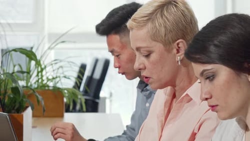 Diverse Team Collaborating in Modern Office Setting