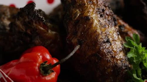 Close Up of Grilled Chicken Wings with Pepper