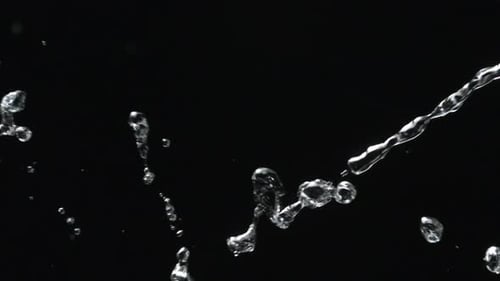 Water Splash Against Black Background