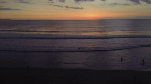 Flight at Sunset Overlooking the Indian Ocean in Bali Indonesia