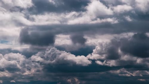 Fast Moving Clouds Against Blue Sky Time-Lapse