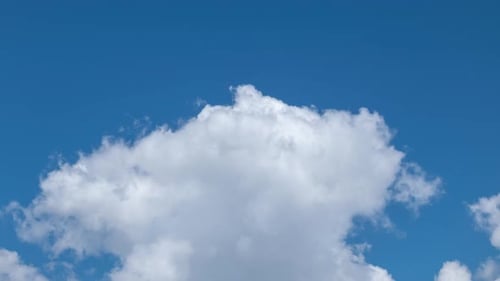 Fluffy White Clouds Moving Fast in Time-lapse. Daylight, Cloudy Heaven Background. Timelapse of