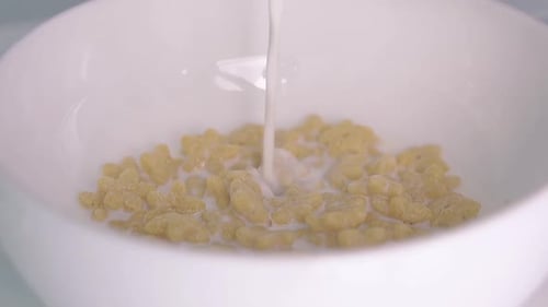 Milk Pouring into a Bowl of Star Cereal