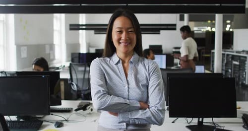 Portrait of asian businesswoman smiling and standing in office