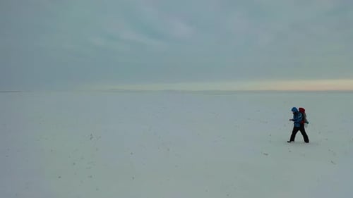 Lonely Human Walk Throw Snowy Desert