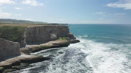 Aerial of a Beautiful High Steep Cliffs Along the Pacific Ocean Coastline