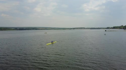 Athletes Training On Kayaks. Group of young athletes training for whitewater rafting