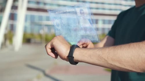 Man Interacting with Smartwatch Holographic Display