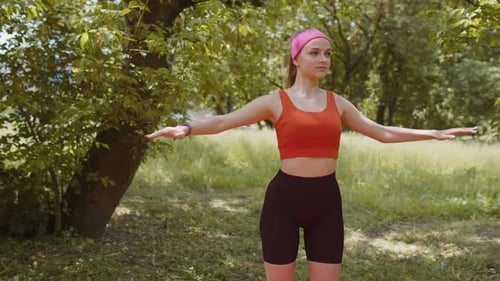Slim Athletic Sporty Girl Athlete Doing Working Out Stretching Fitness Exercises Outdoors in Park
