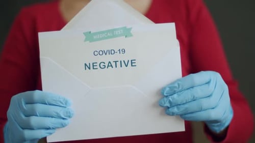 COVID-19 Negative Test Result Held in Envelope