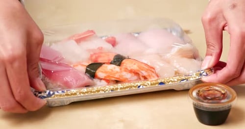 Eating sushi take away at home