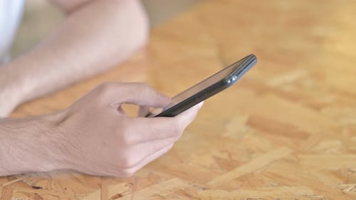 Close Up of Hands Texting on Smartphone