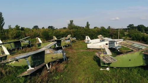 Squadron of Left AN2 Airplanes at Abandoned Air Base