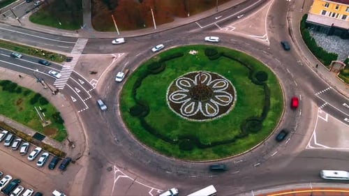 Aerial View Timelapse of Roundabout Road with Circular Cars in Small European City