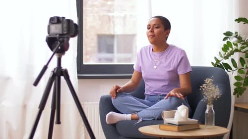 Woman Vlogging in Living Room with Camera