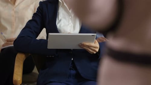 Adults Using Tablets in Waiting Room