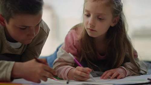 Children Drawing Together Indoors