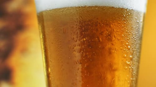 Refreshing Cold Beer with Condensation Close Up