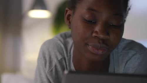 Black Woman Using Smartphone at Night