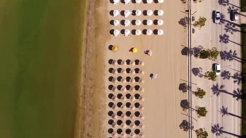 Concept of summer vacation. View from above, aerial view of an amazing beach with beach umbrellas