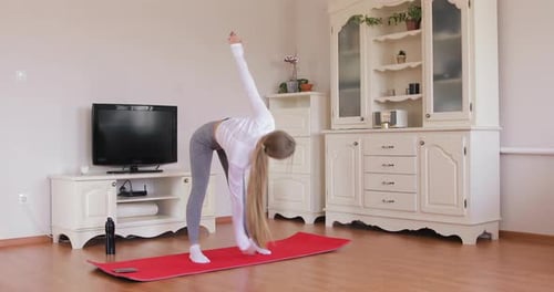 Athletic Woman Doing Side Stretches at Home