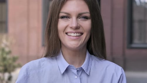 Close-up of Smiling Woman Looking at Camera