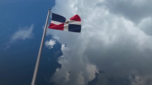 Dominican Republic Flag Waving Against Dynamic Sky