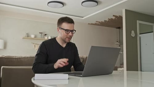 Man on Video Call Working Remotely at Home