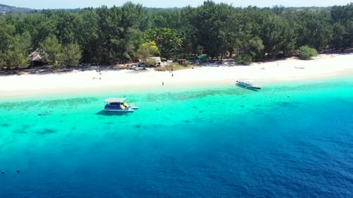 Tropical fly over travel shot of a white sandy paradise beach and turquoise sea background in colorf
