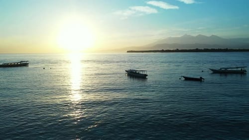 Wide angle overhead travel shot of a white sandy paradise beach and turquoise sea background in high