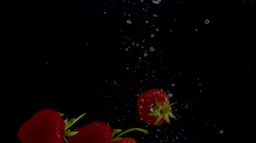 Strawberry Slow Motion Closeup Falling in Water