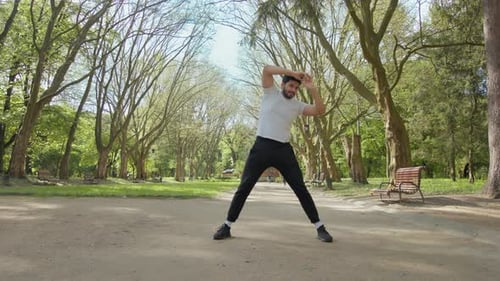 Young Adult Man Stretching in Park