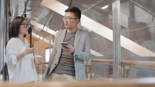 Young Adults Chatting During Office Break