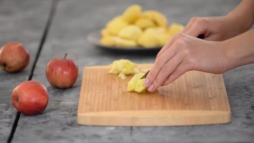 Close Up of Apples Being Diced on Cutting Board