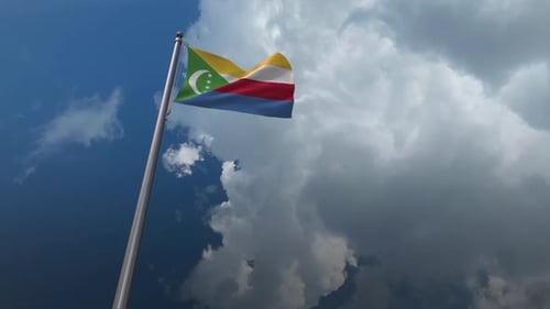 National Flag of Comoros Waving Against Cloudy Blue Sky