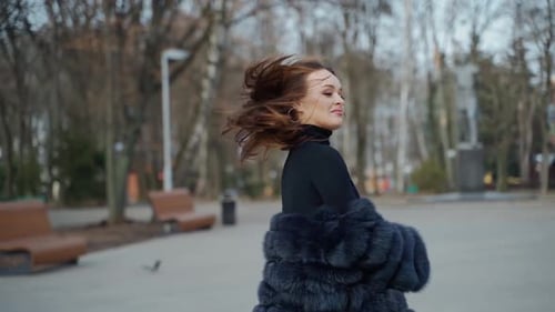 Stylish Woman Posing in a City Park