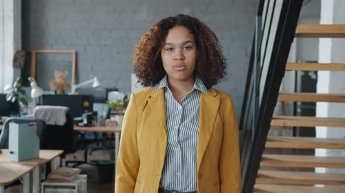 Slow Motion Portrait of Serious Business Lady Smiling Crossing Arms Standing in Office