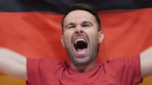 Man Cheers with Flag Background