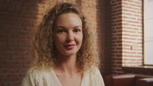 Smiling Curly Haired Woman Close Up Portrait