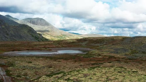 Aerial View of Mountain Ranges with Beautiful Blue Sky in the Background