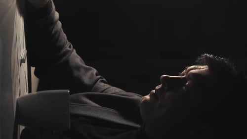 Dark Haired Man Drinking From Mug Indoors